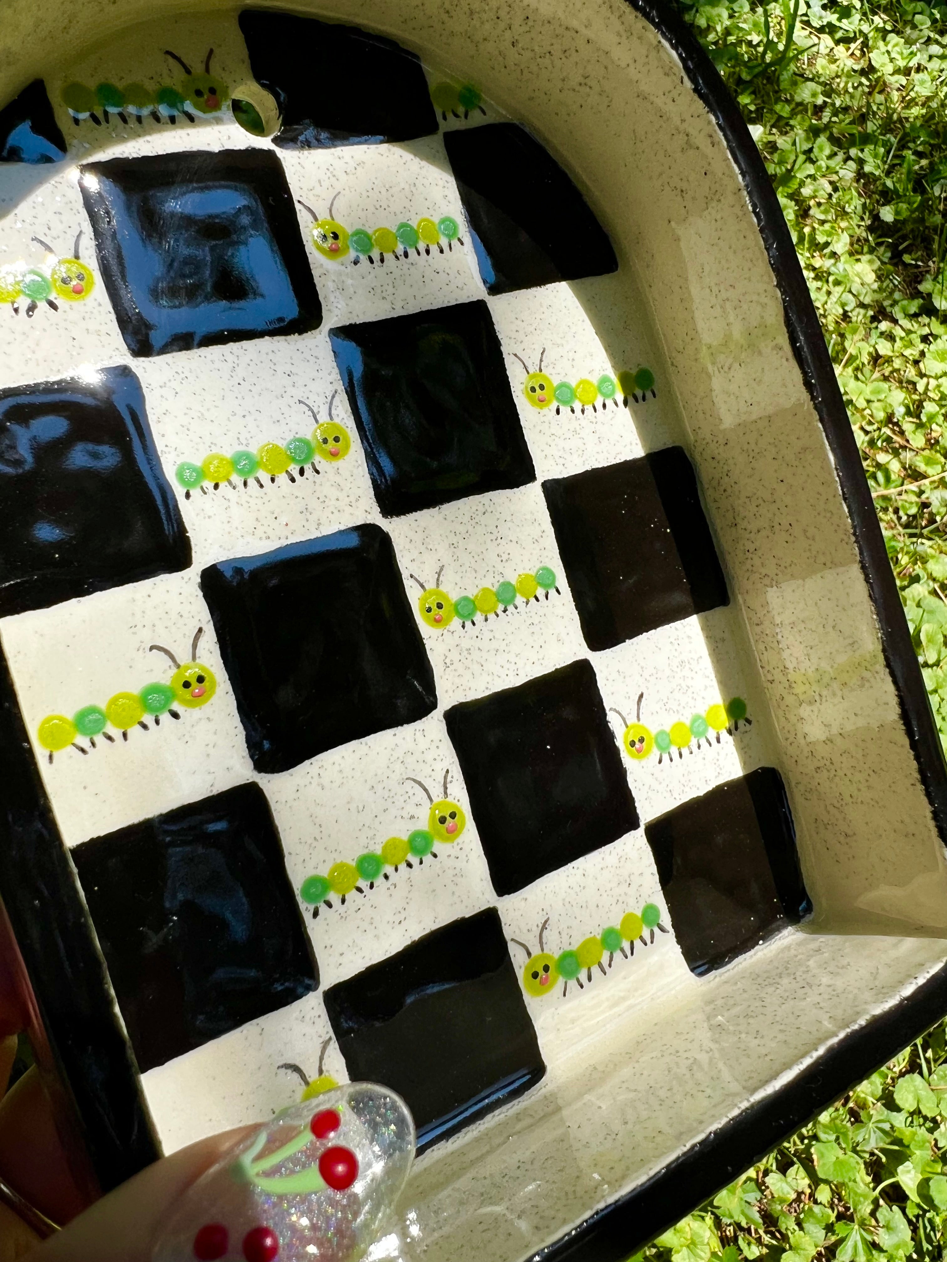 Ceramic caterpillar trinket shelf