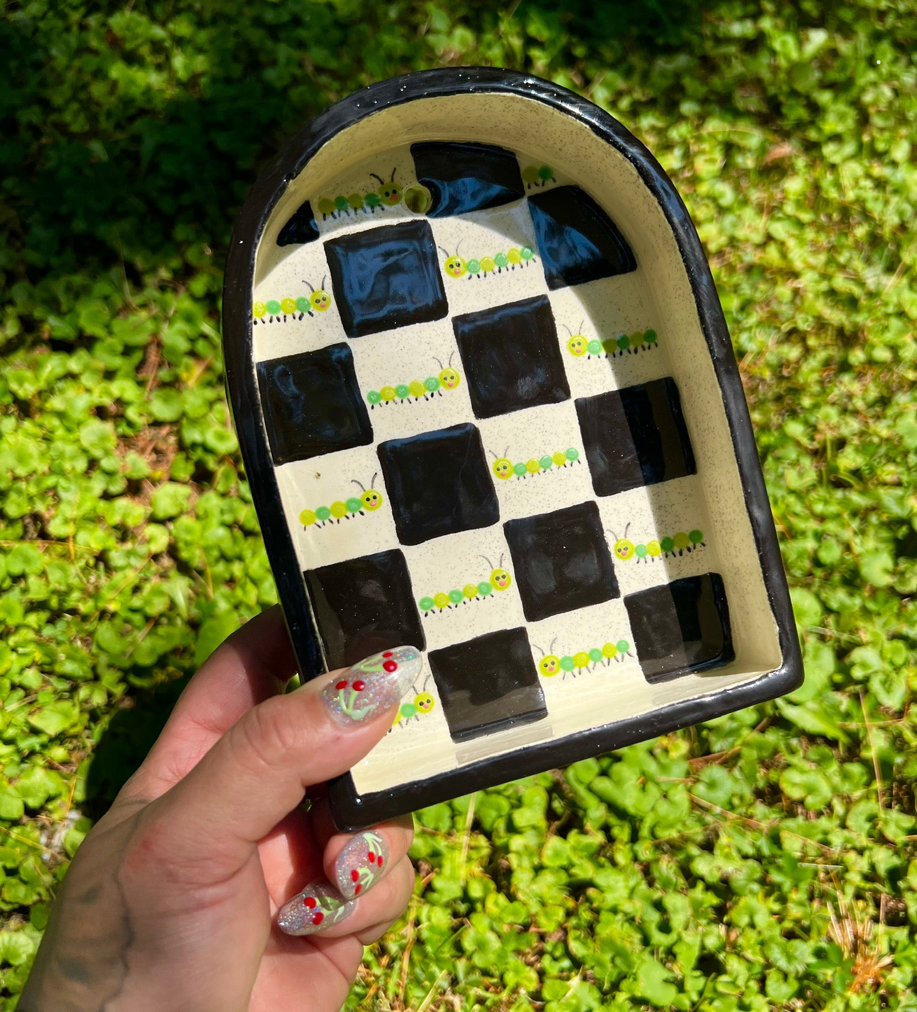 Ceramic caterpillar trinket shelf