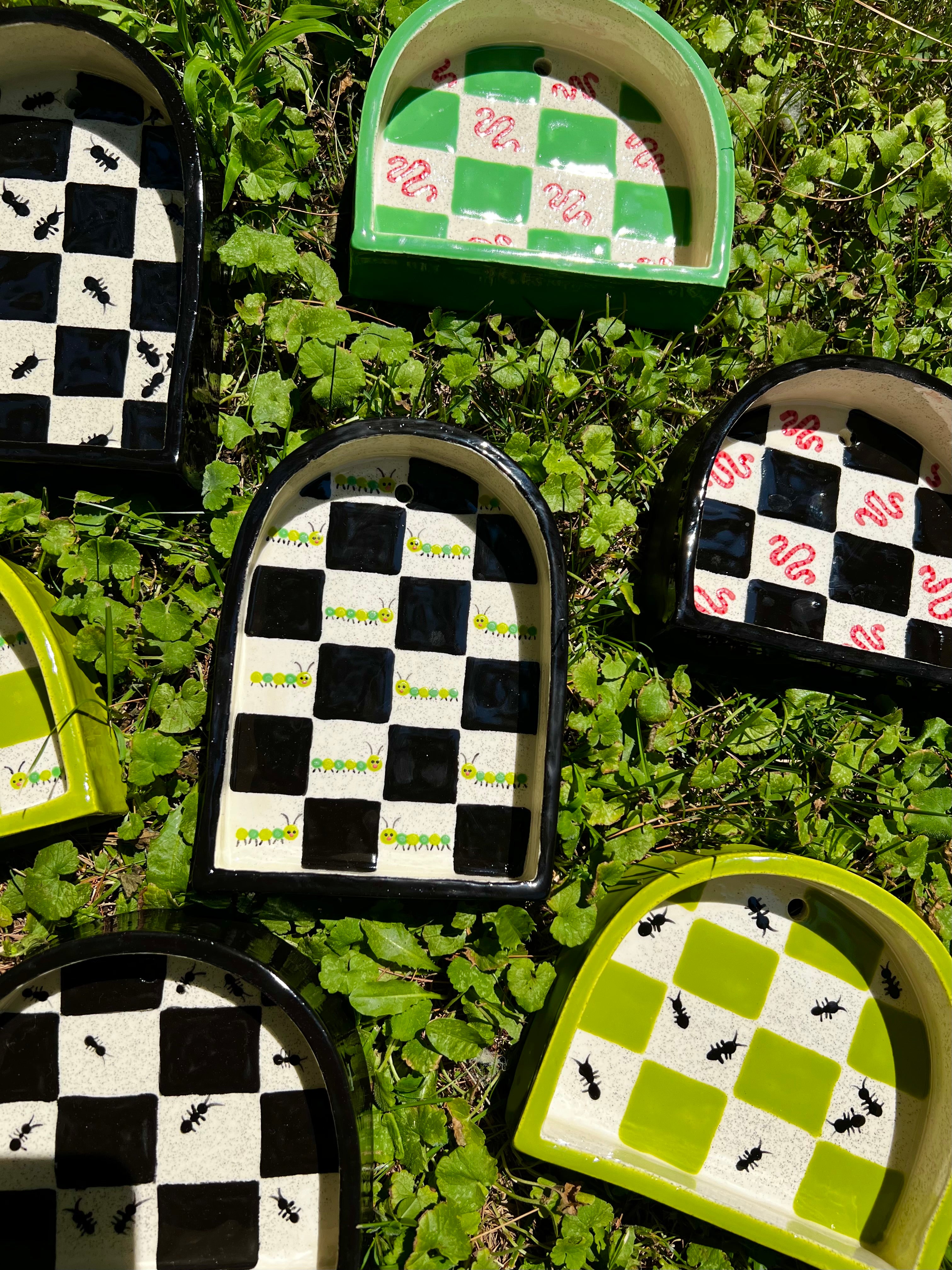 Ceramic caterpillar trinket shelf