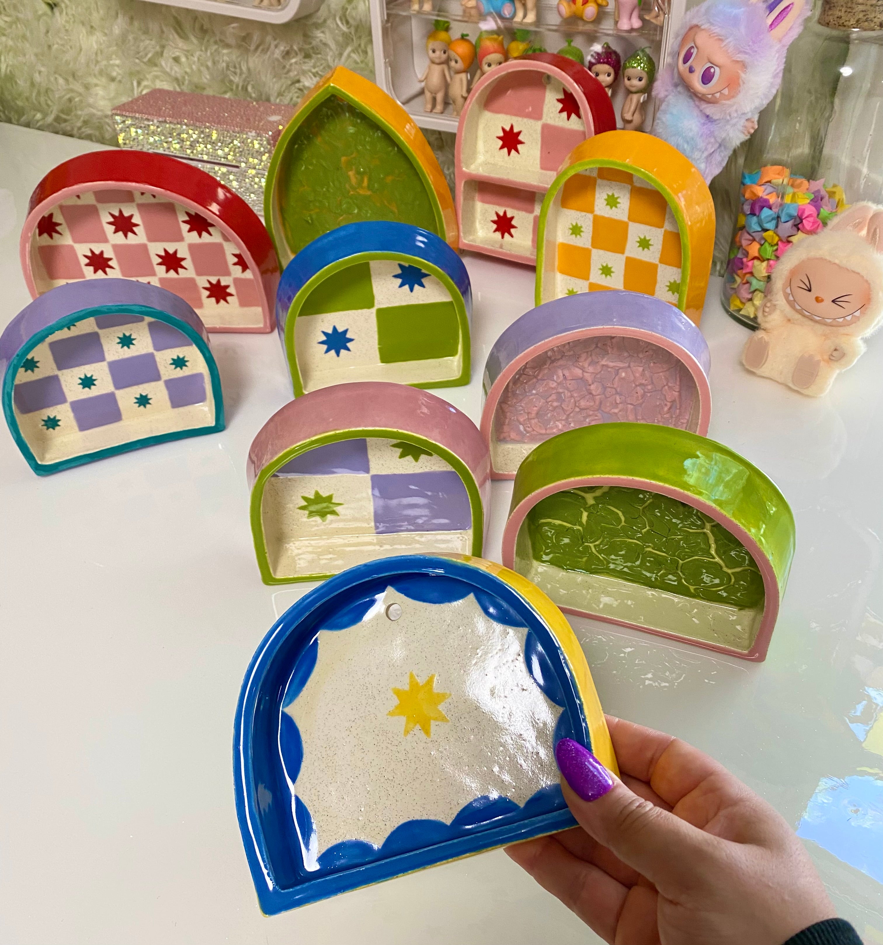 Ceramic ant trinket shelf