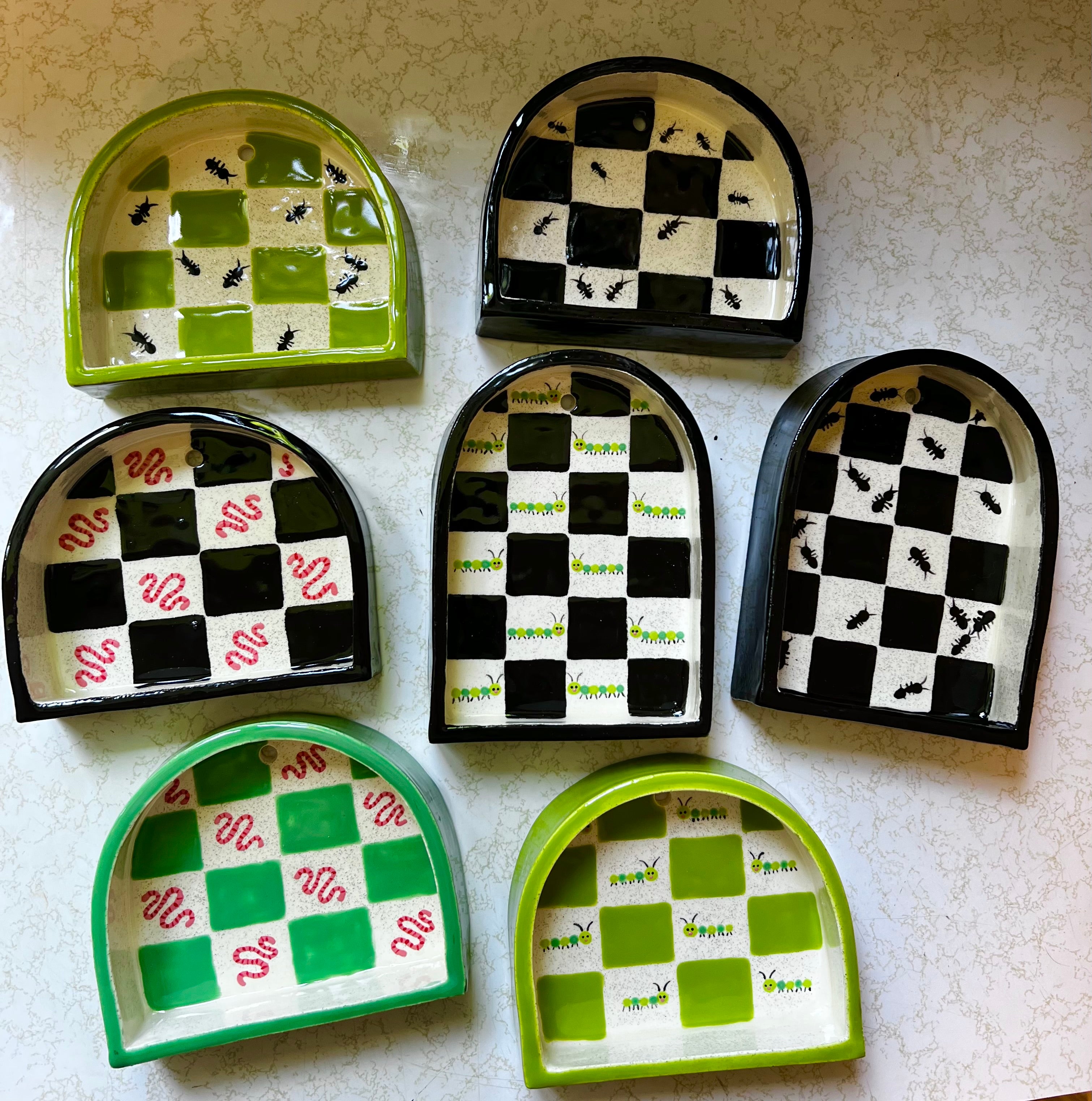 Ceramic caterpillar trinket shelf