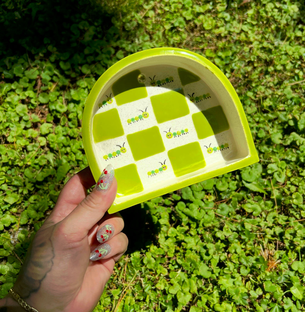 Ceramic caterpillar trinket shelf