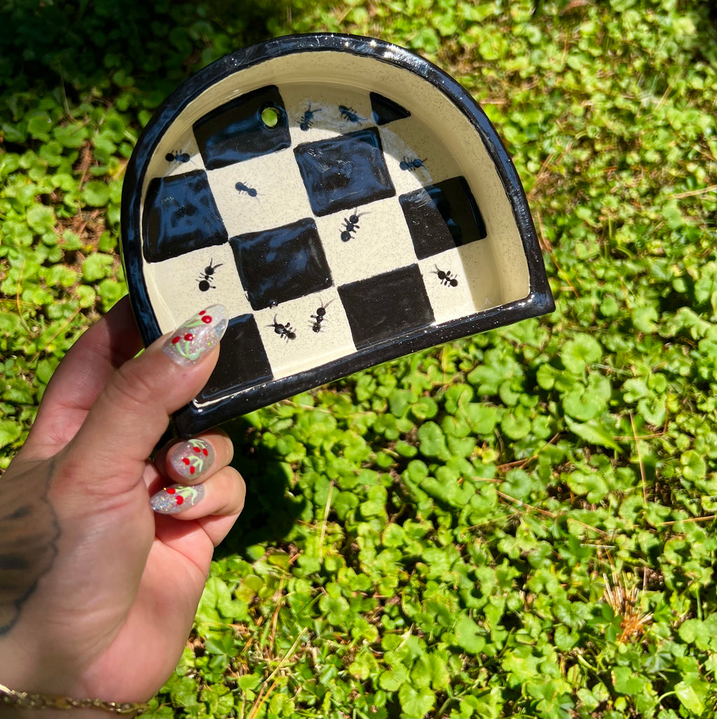 Ceramic ant trinket shelf
