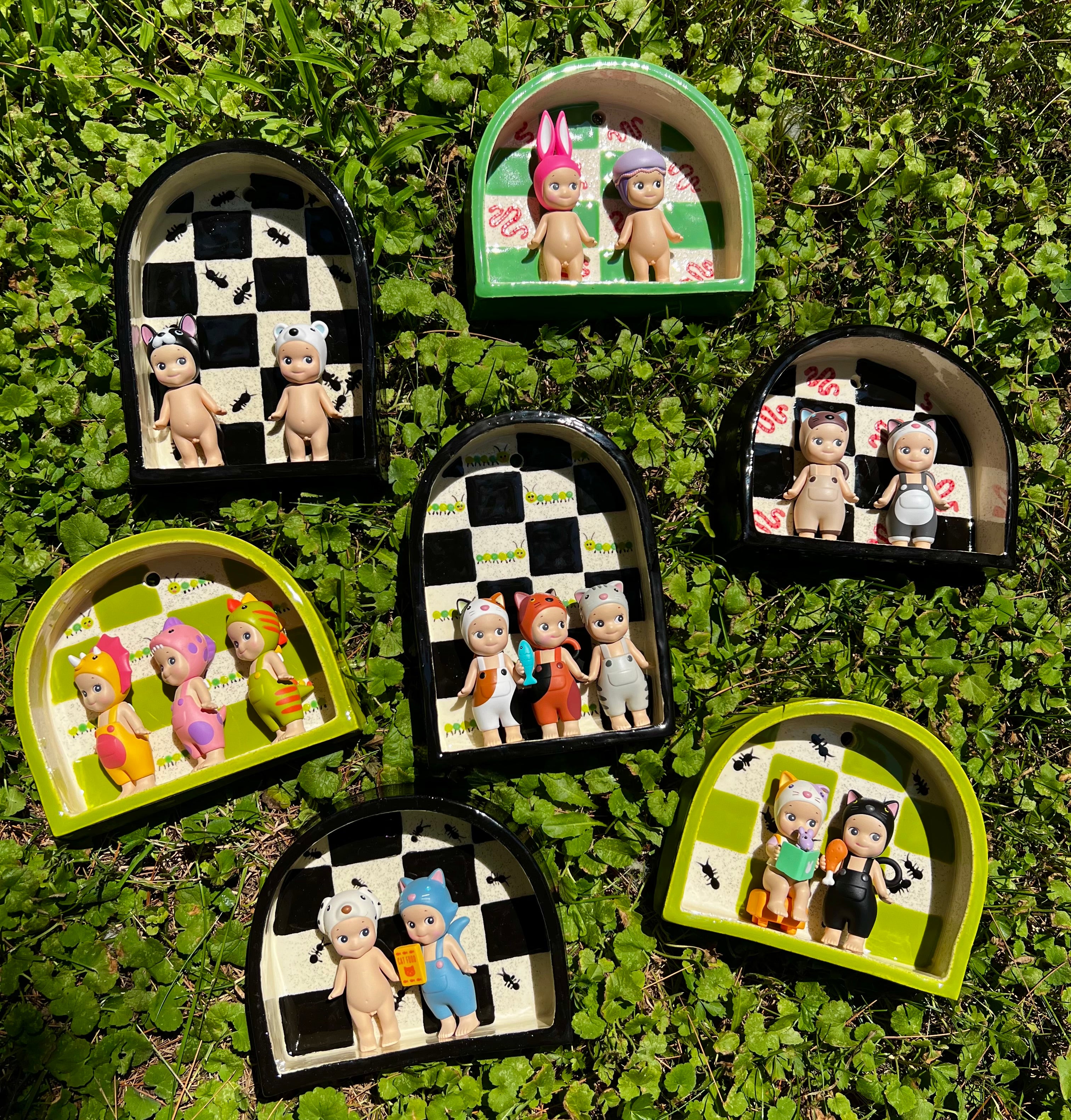 Ceramic caterpillar trinket shelf