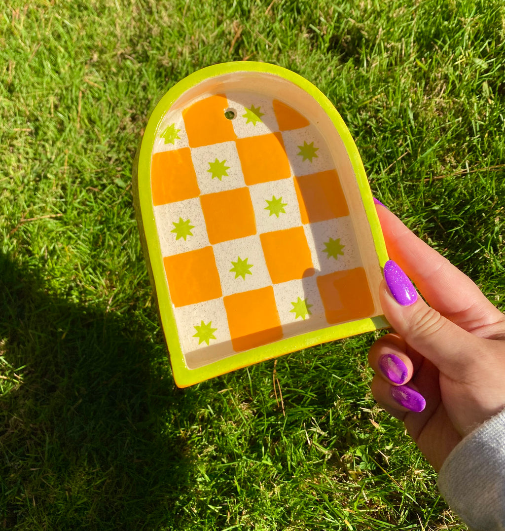 Ceramic ant trinket shelf