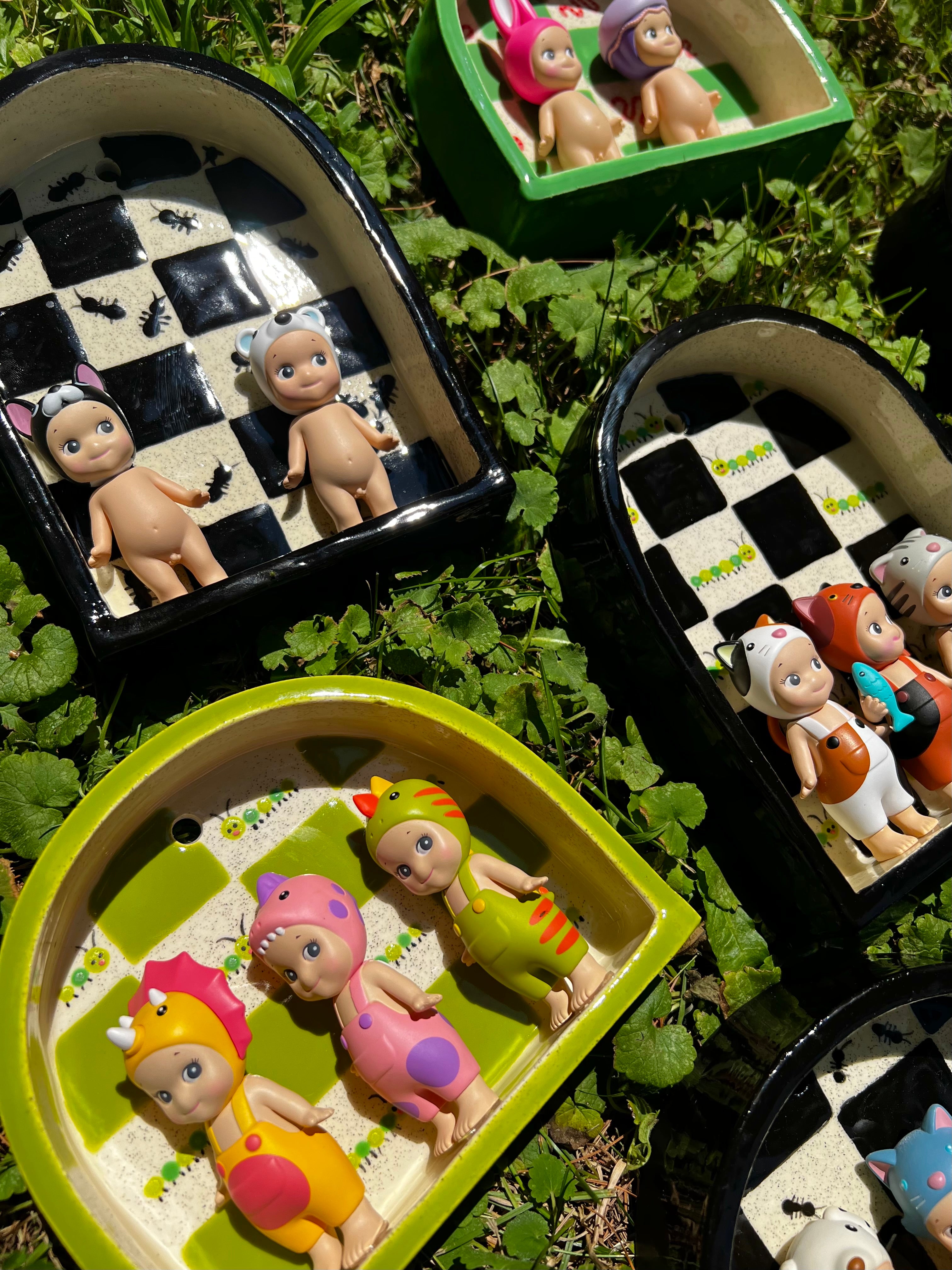 Ceramic caterpillar trinket shelf