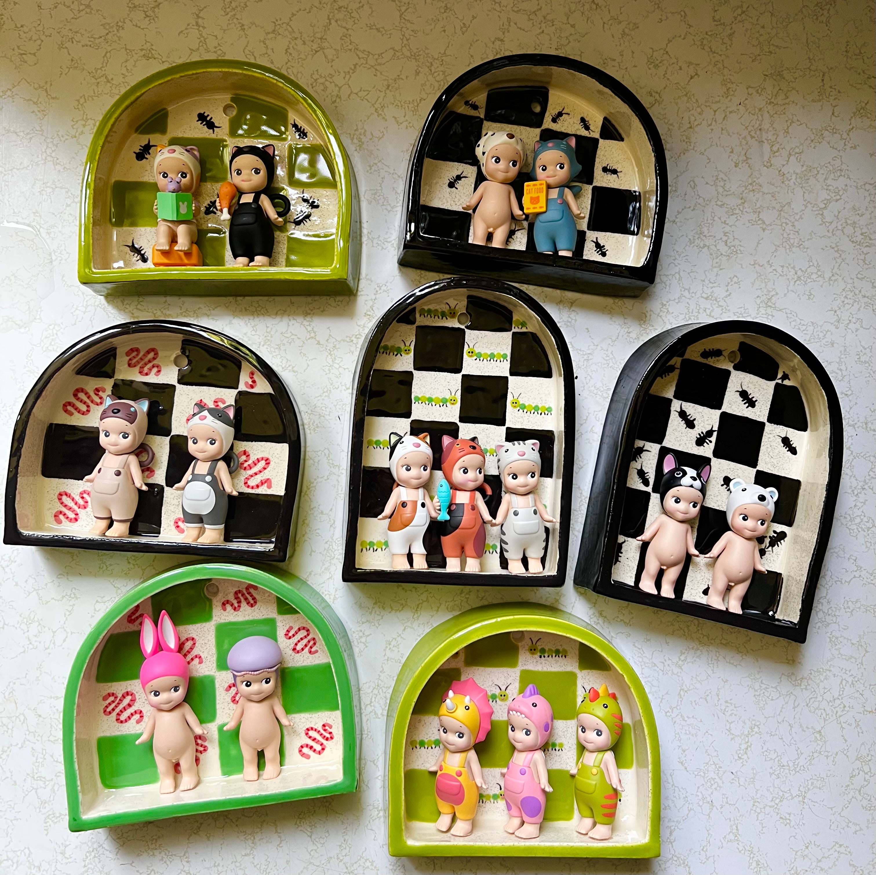 Ceramic ant trinket shelf