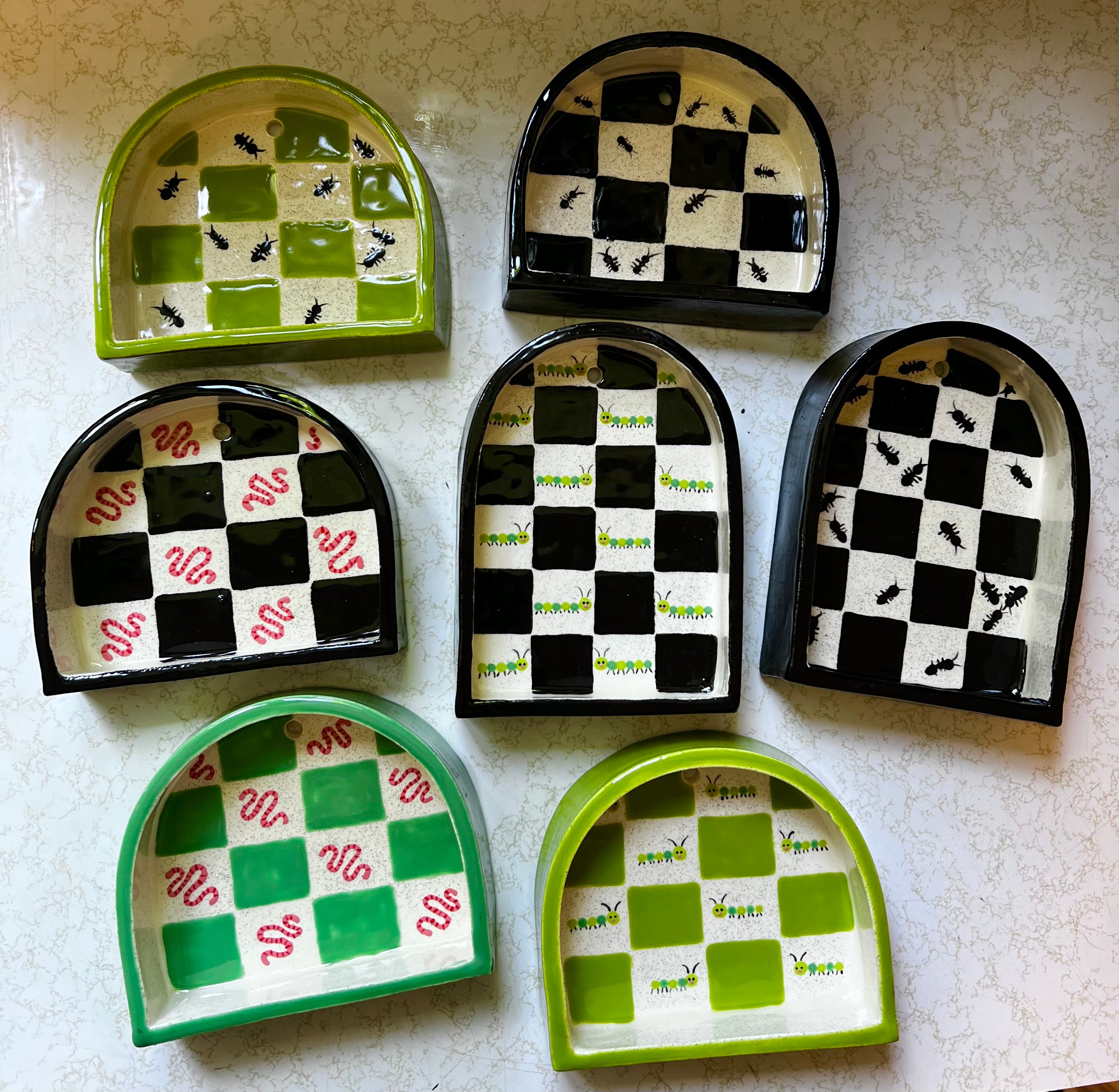 Ceramic ant trinket shelf